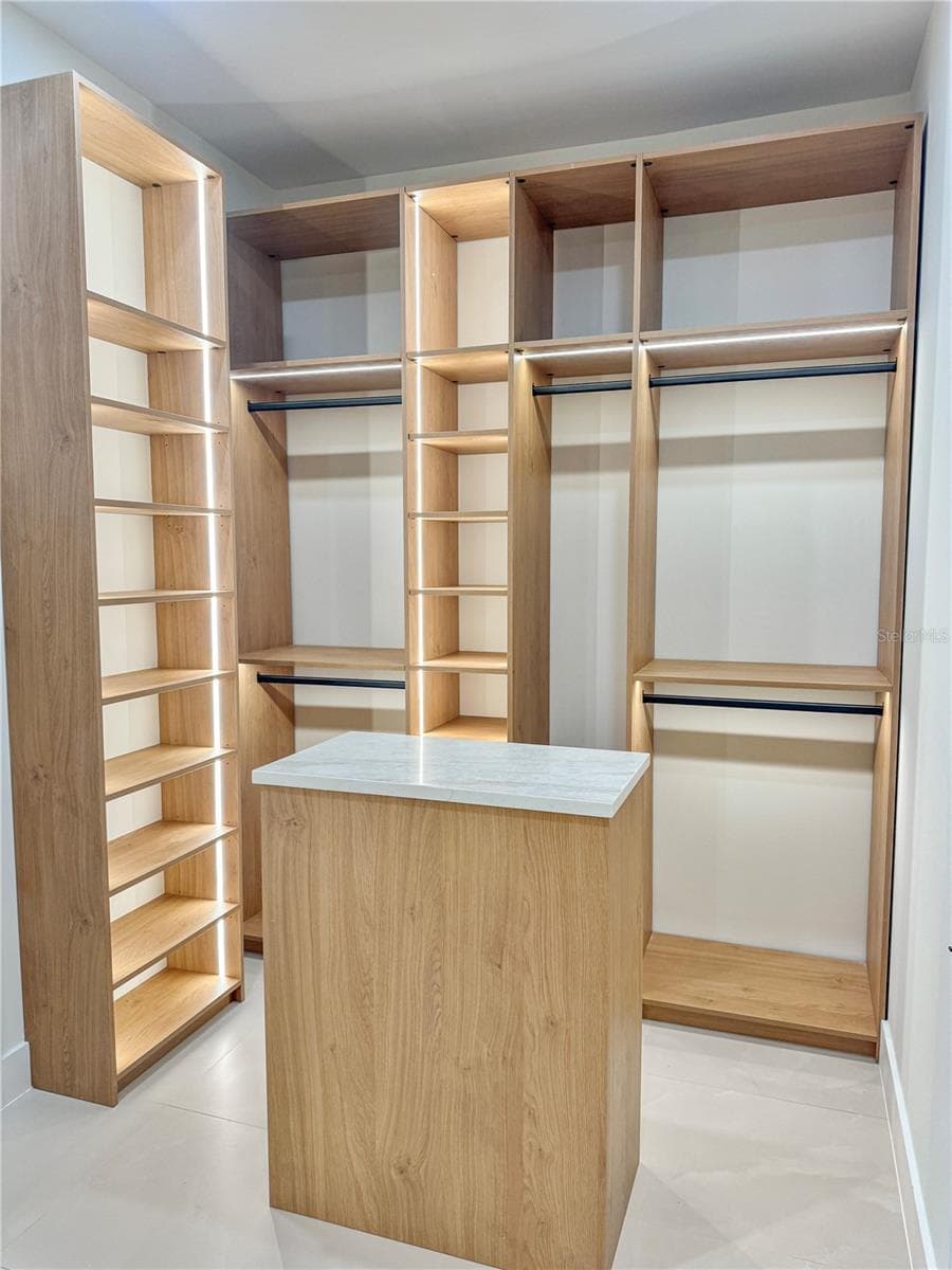 Master Walk-In Closet with Custom Cabinets - 8568 SANTA CRUZ DR, PORT CHARLOTTE