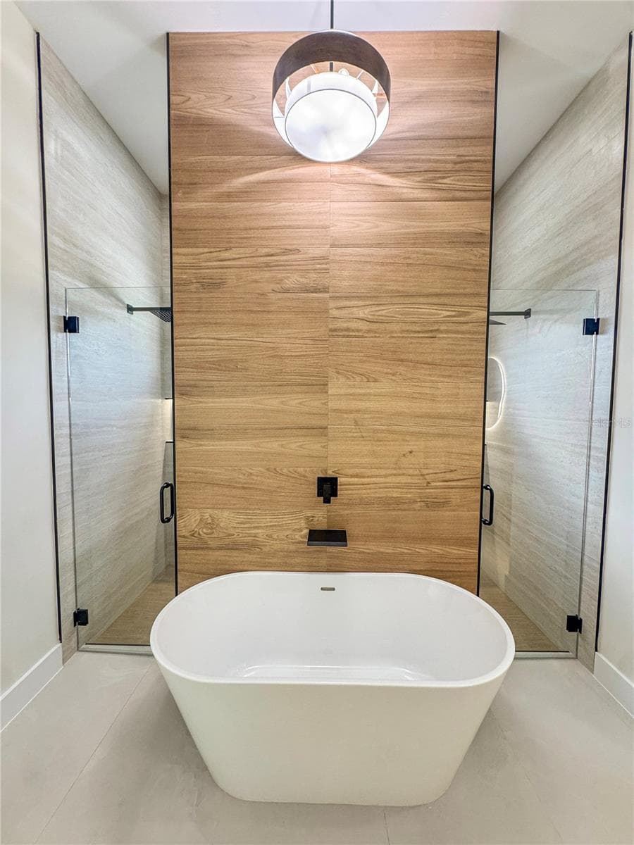 Master Bathroom with Freestanding Tub and Tiled Accent Wall - 8568 SANTA CRUZ DR, PORT CHARLOTTE
