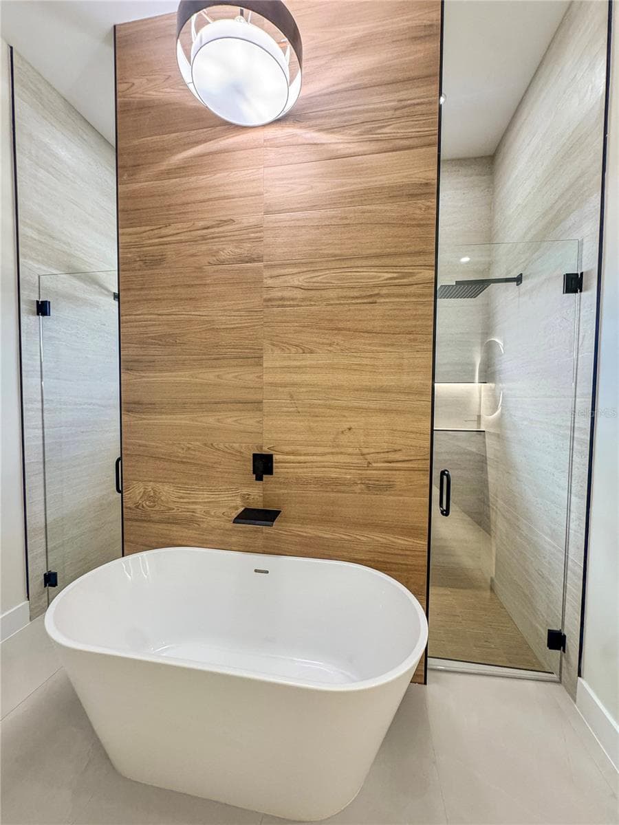 Master Bathroom with Freestanding Tub and Tiled Accent Wall - 8568 SANTA CRUZ DR, PORT CHARLOTTE
