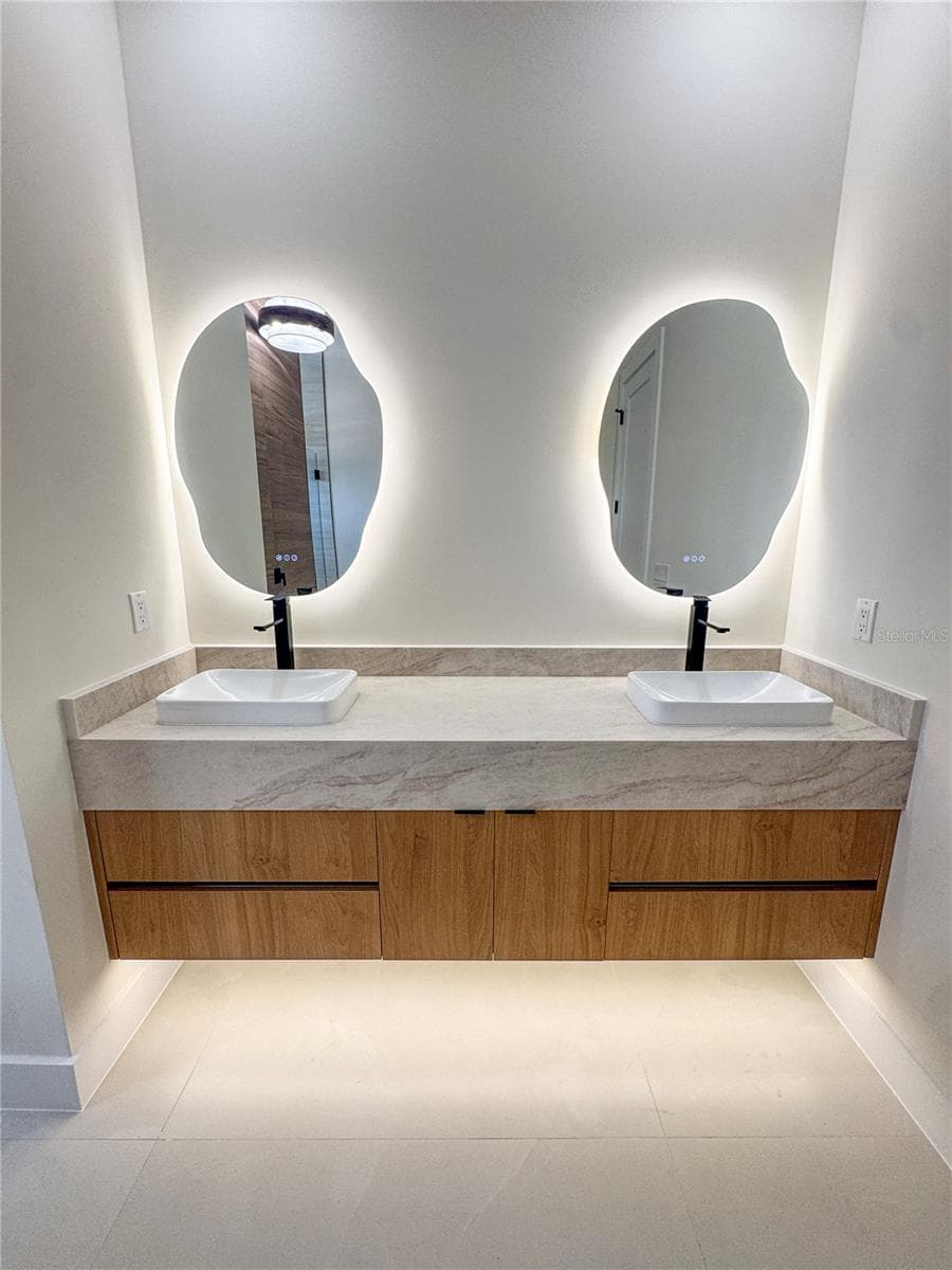 Master Bathroom with Double-Sink Vanity and LED Mirrors - 8568 SANTA CRUZ DR, PORT CHARLOTTE