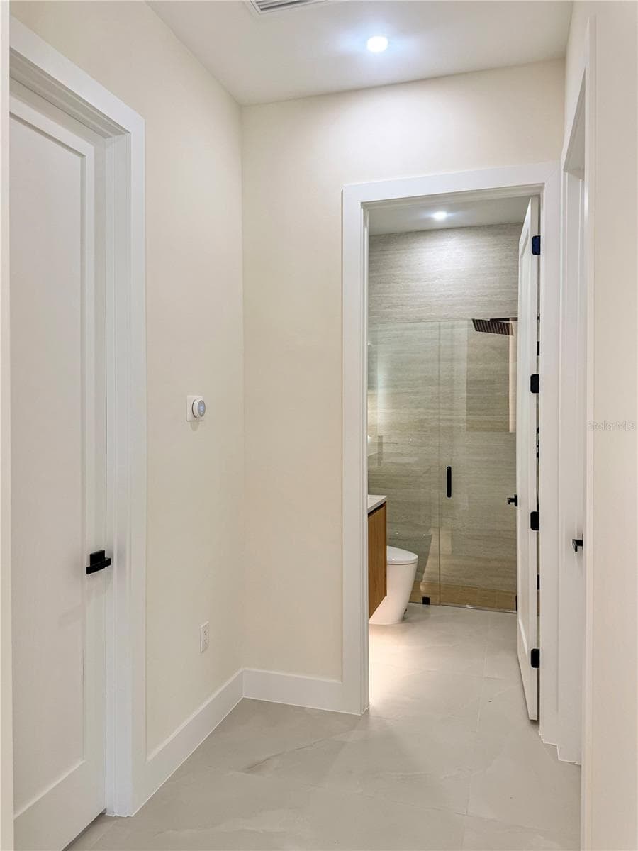 Hallway Leading to Bathroom and Rooms - 8568 SANTA CRUZ DR, PORT CHARLOTTE