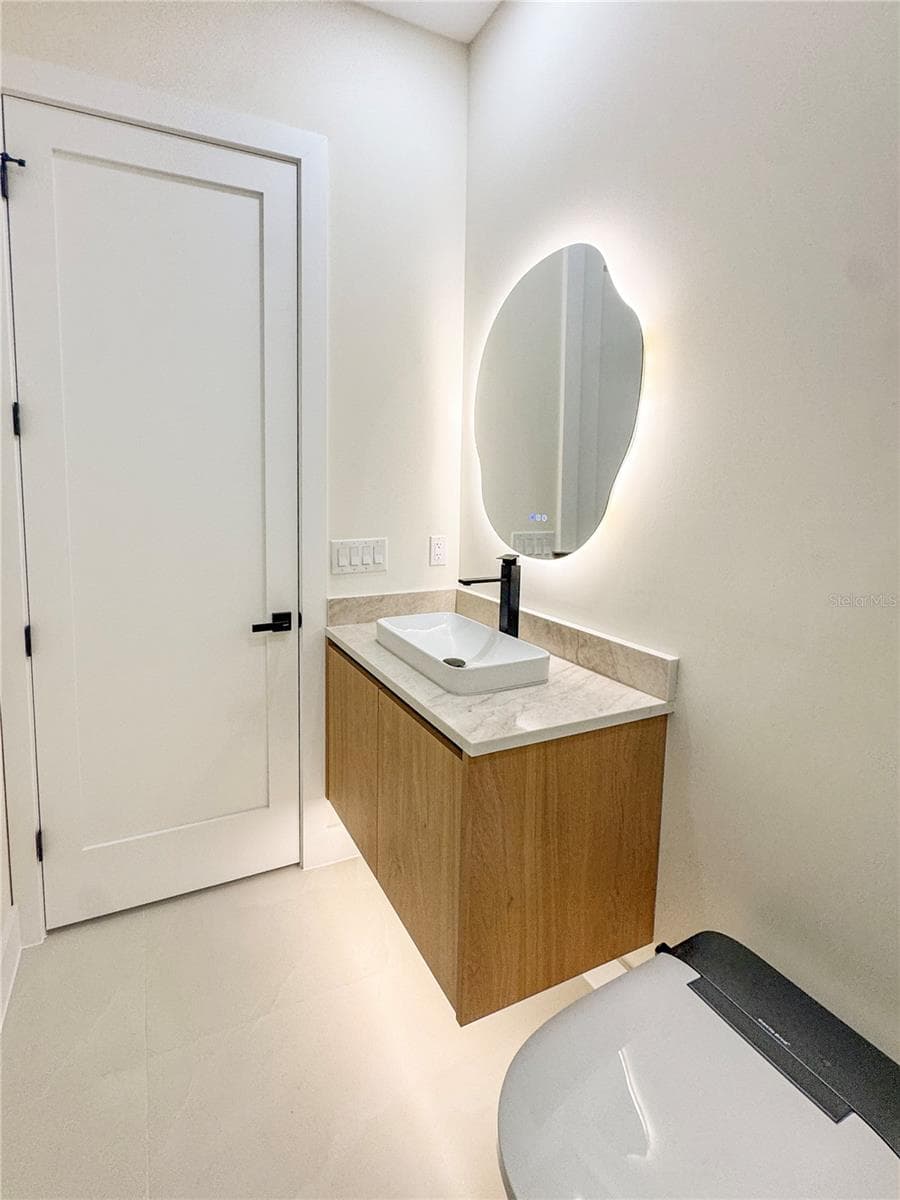 Bathroom 2 with Custom Vanity and LED Mirror - 8568 SANTA CRUZ DR, PORT CHARLOTTE