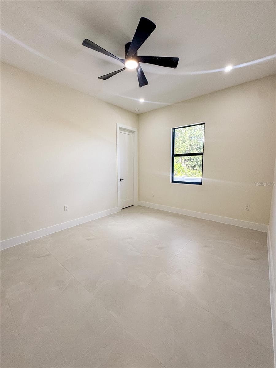 Bedroom 2 with Ceiling Fan and Porcelain Tile Flooring - 8568 SANTA CRUZ DR, PORT CHARLOTTE