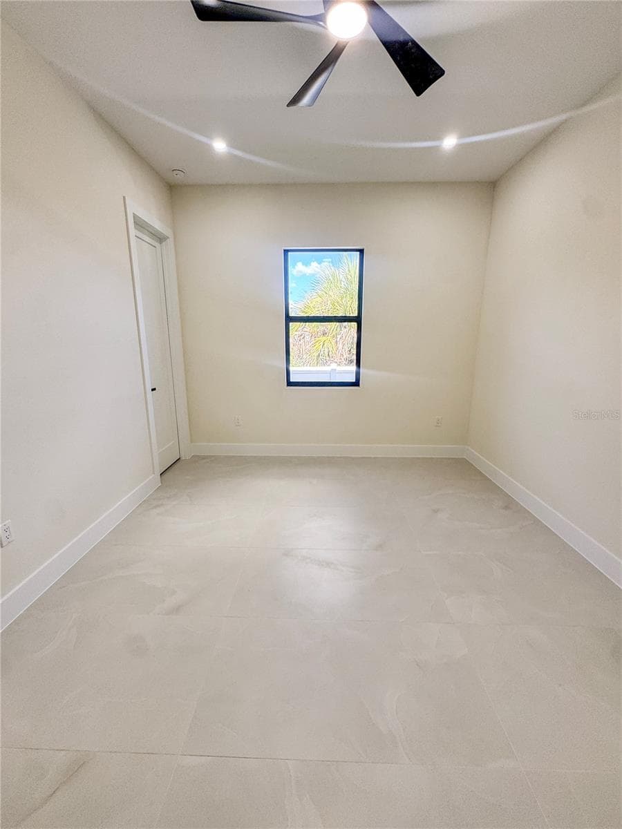 Bedroom 2 with Ceiling Fan and Porcelain Tile Flooring - 8568 SANTA CRUZ DR, PORT CHARLOTTE