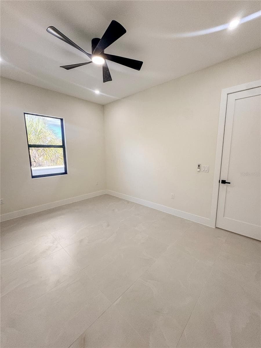 Bedroom 2 with Ceiling Fan and Porcelain Tile Flooring - 8568 SANTA CRUZ DR, PORT CHARLOTTE