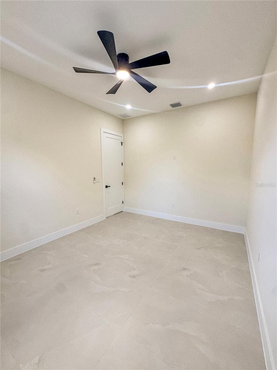 Bedroom 2 with Ceiling Fan and Porcelain Tile Flooring - 8568 SANTA CRUZ DR, PORT CHARLOTTE