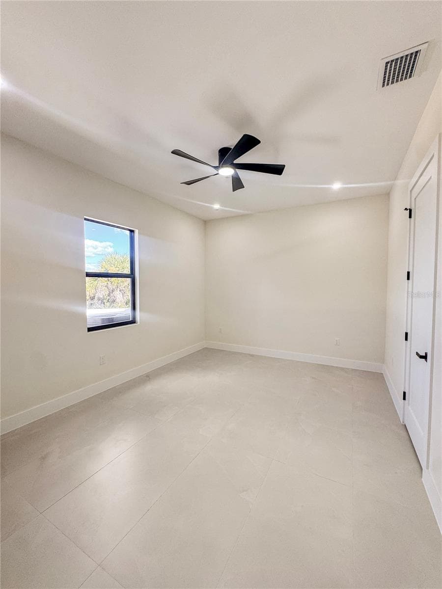 Bedroom 3 with Ceiling Fan and Porcelain Tile Flooring - 8568 SANTA CRUZ DR, PORT CHARLOTTE