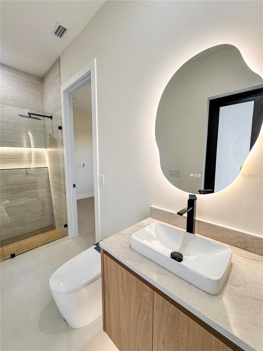 Bathroom 3 with Custom Vanity and LED Mirror - 8568 SANTA CRUZ DR, PORT CHARLOTTE