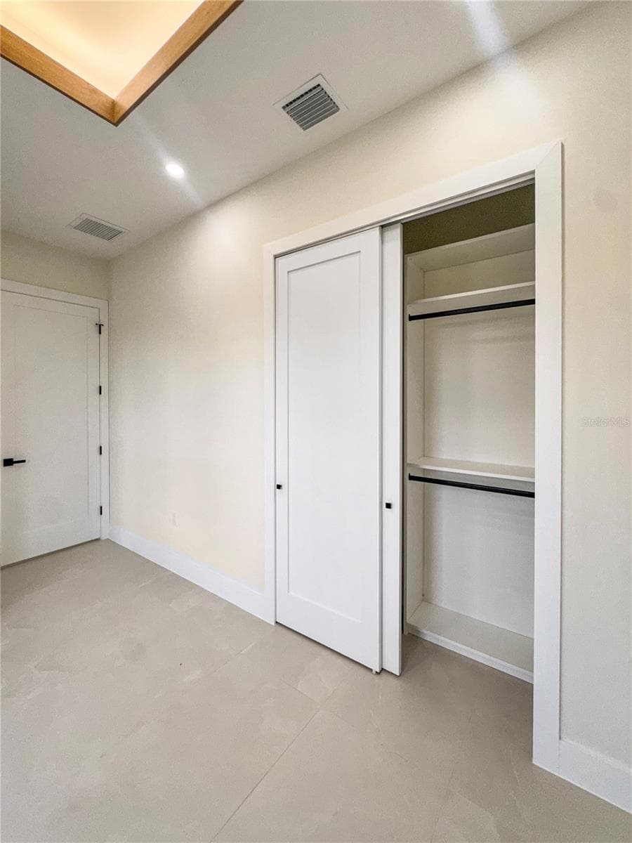 Bedroom 4 with Closet and Custom Cabinets - 8568 SANTA CRUZ DR, PORT CHARLOTTE
