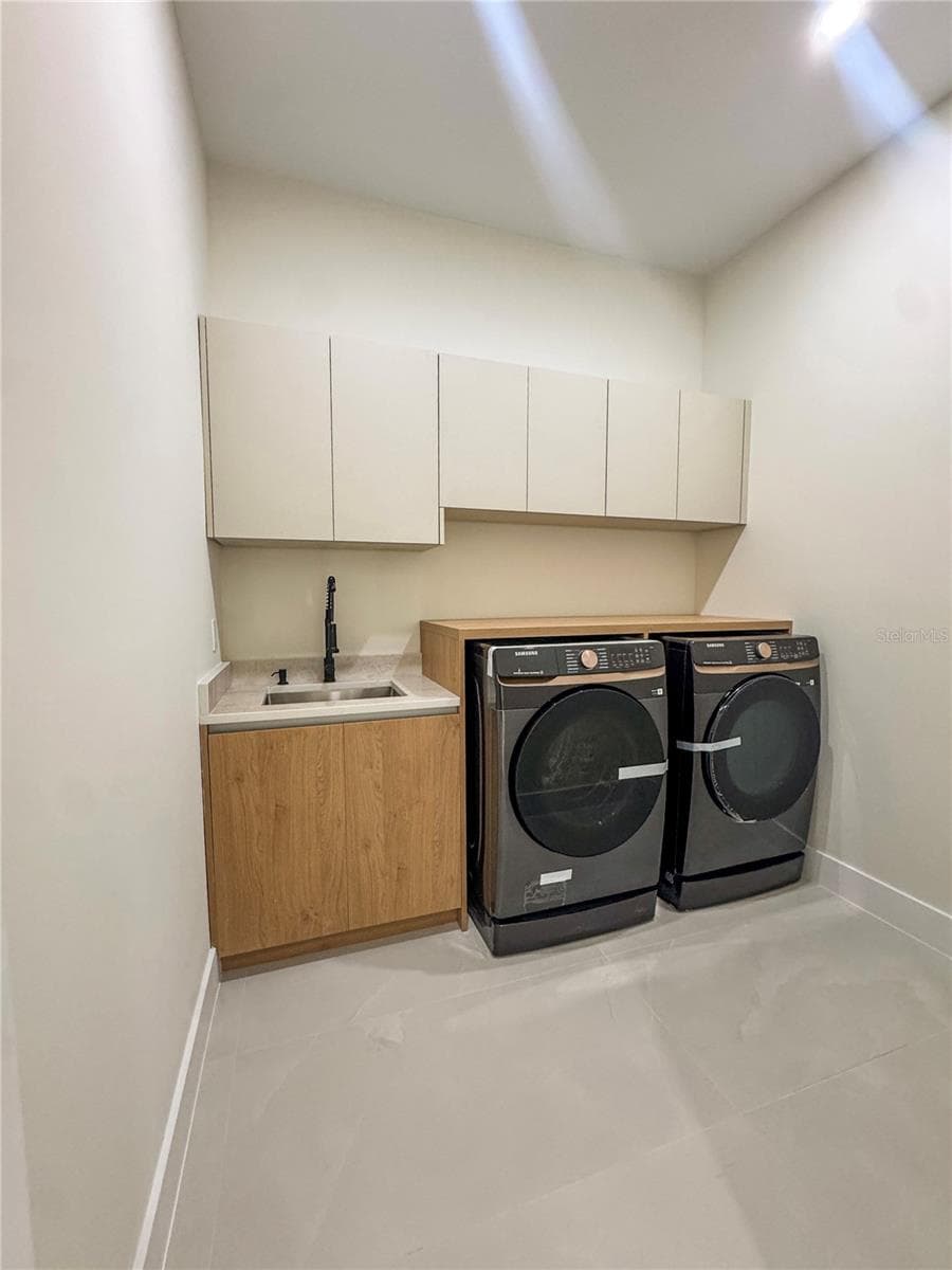 Laundry Room with Washer, Dryer and Storage Cabinets - 8568 SANTA CRUZ DR, PORT CHARLOTTE