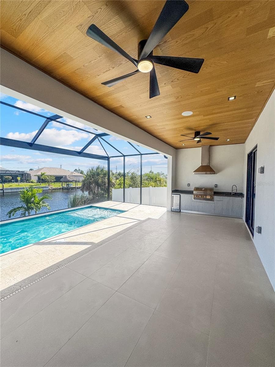 Covered Lanai with Custom Wood Ceiling, Ceiling Fans and Pool View - 8568 SANTA CRUZ DR, PORT CHARLOTTE