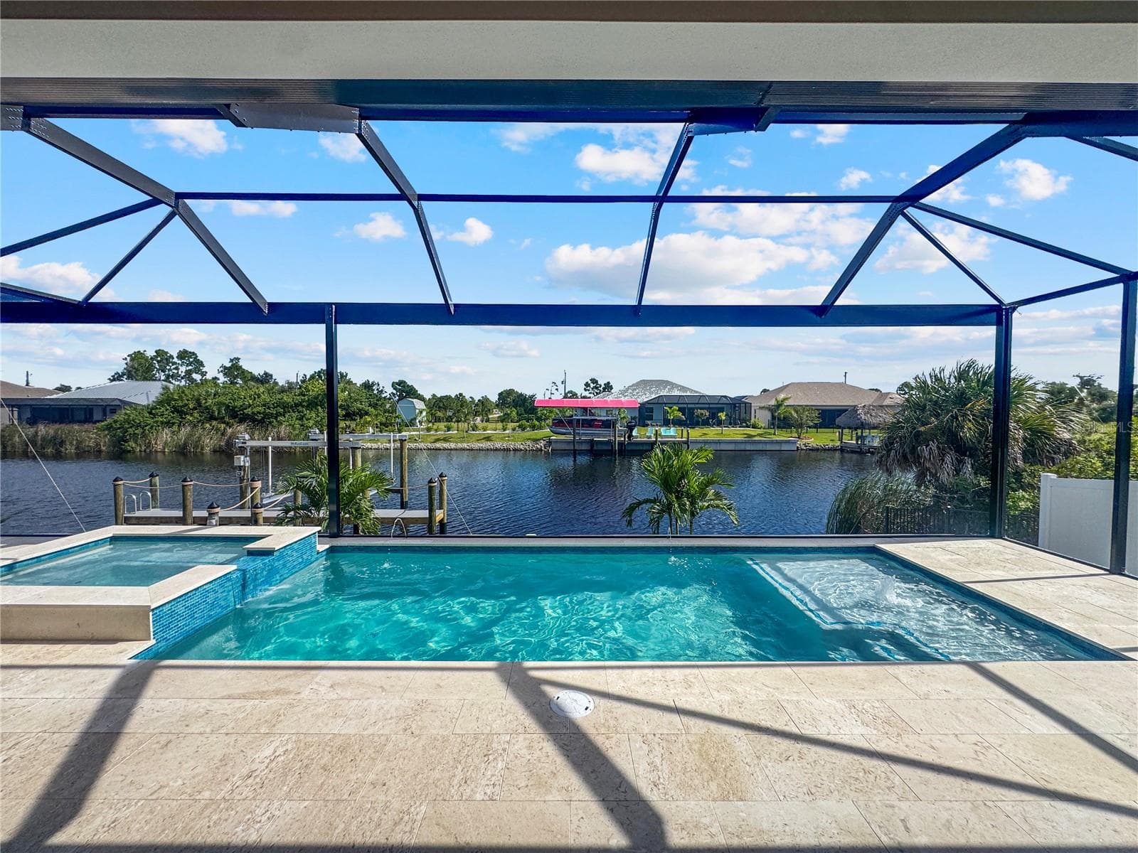 Heated Saltwater Pool with Screened Enclosure and Canal View - 8568 SANTA CRUZ DR, PORT CHARLOTTE