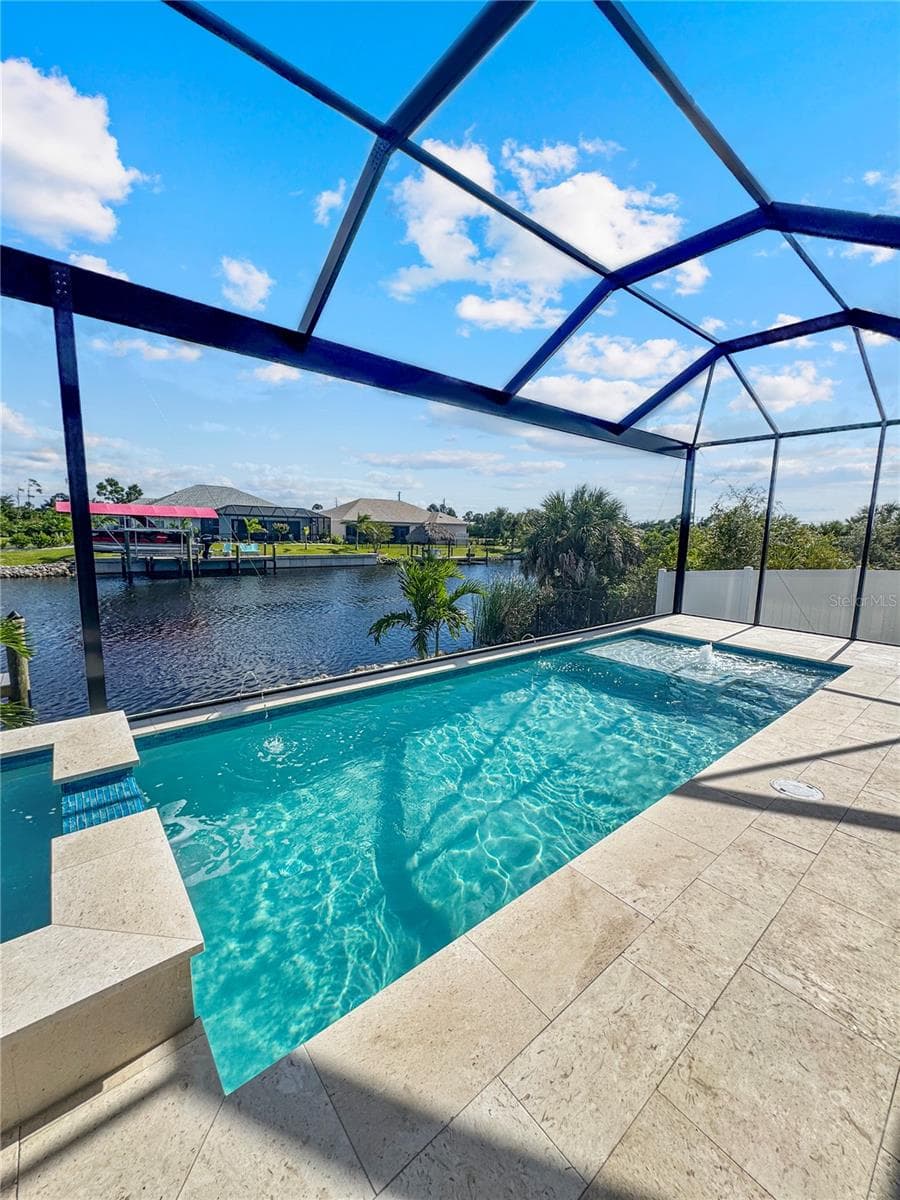 Pool with Sun Shelf and Screened Enclosure - 8568 SANTA CRUZ DR, PORT CHARLOTTE