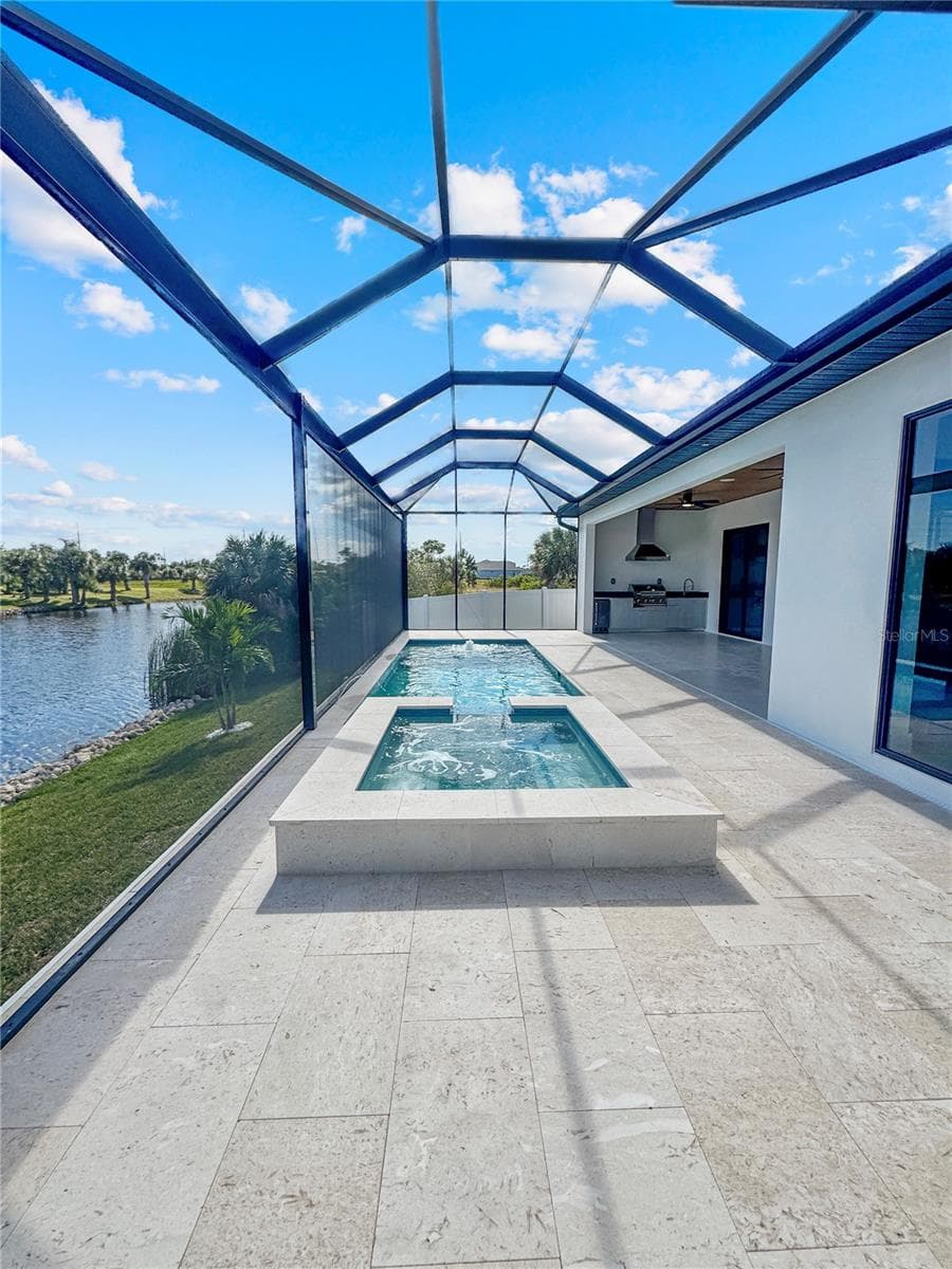 Pool with Sun Shelf and Screened Enclosure - 8568 SANTA CRUZ DR, PORT CHARLOTTE