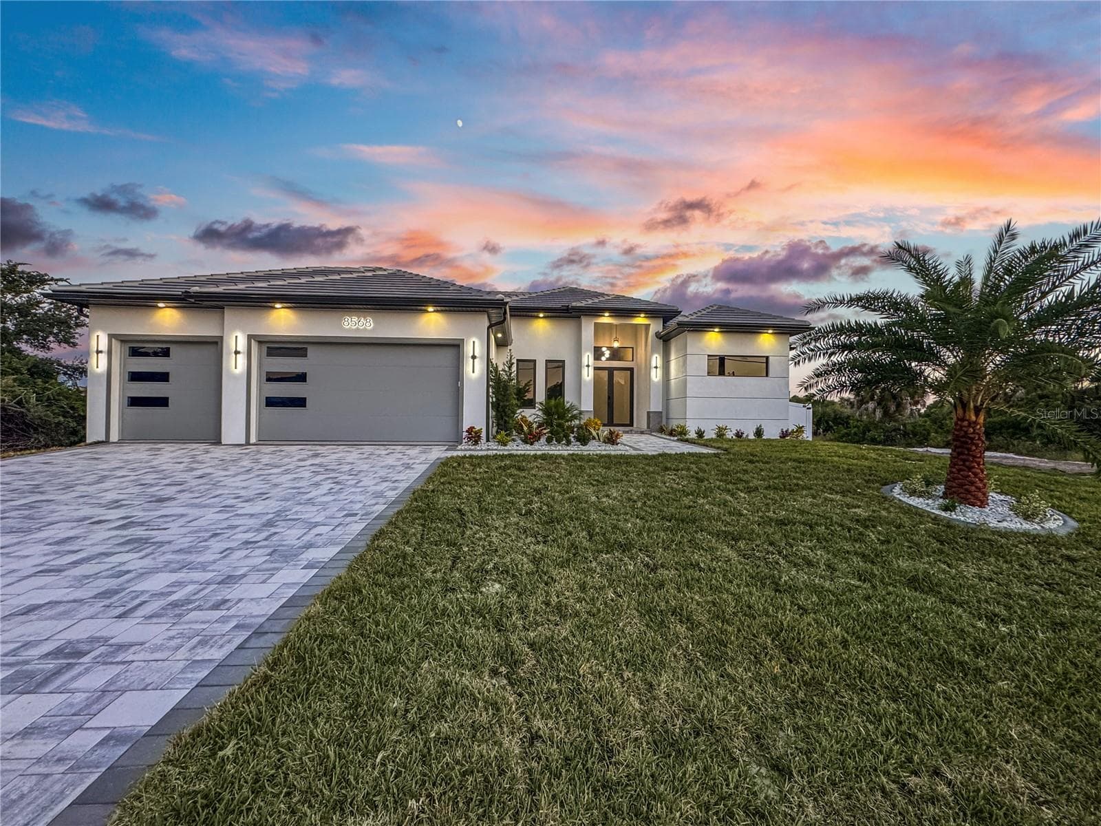 Front Exterior View of Home at Sunset - 8568 SANTA CRUZ DR, PORT CHARLOTTE
