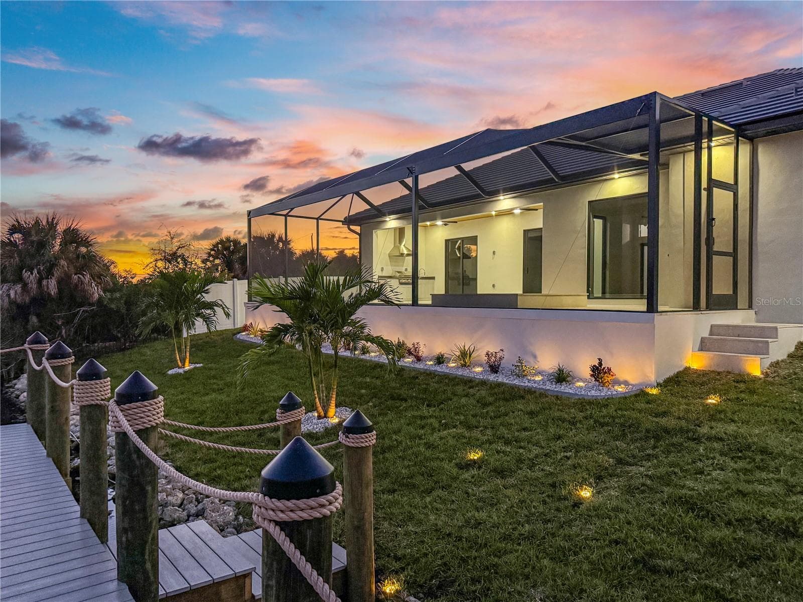 Rear Exterior View with Sunset Sky - 8568 SANTA CRUZ DR, PORT CHARLOTTE
