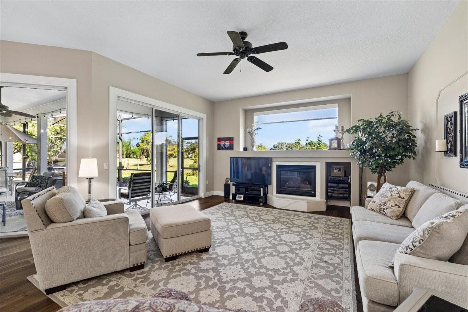 Family room with 2 sets of sliders providing that indoor outdoor Florida lifestyle - 9921 LAUREL VALLEY AVENUE CIR, BRADENTON