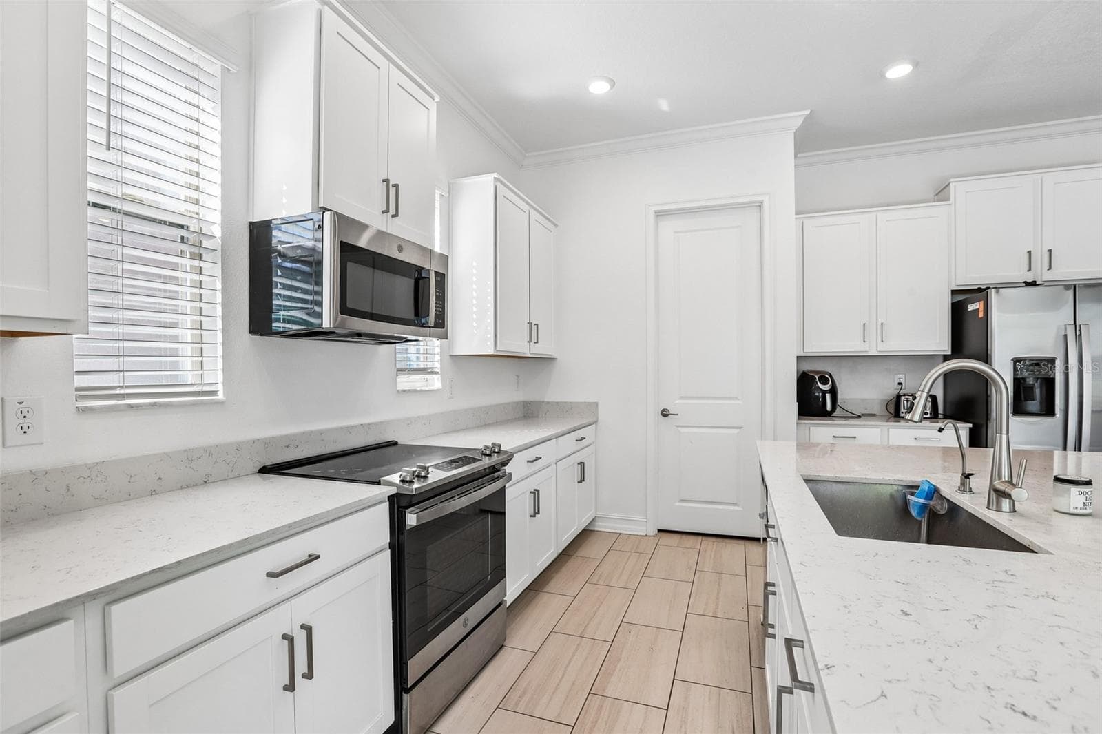 Single Family Residence at 7702 S KISSIMMEE ST, TAMPA, photo 10 of 37