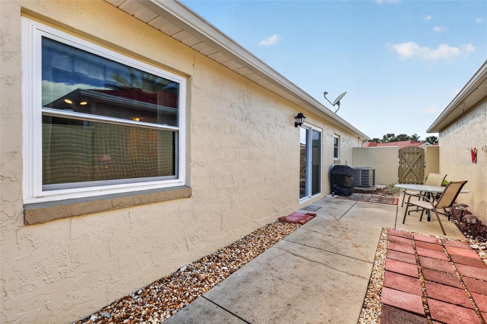 Spacious 45'x11' PRIVATE Side Courtyard and Rear Stoned Yard - 407 CARMEL AVE, THE VILLAGES