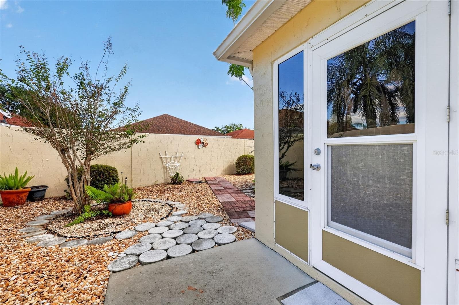 Rear Stoned Yard- NO GRASS! - 407 CARMEL AVE, THE VILLAGES