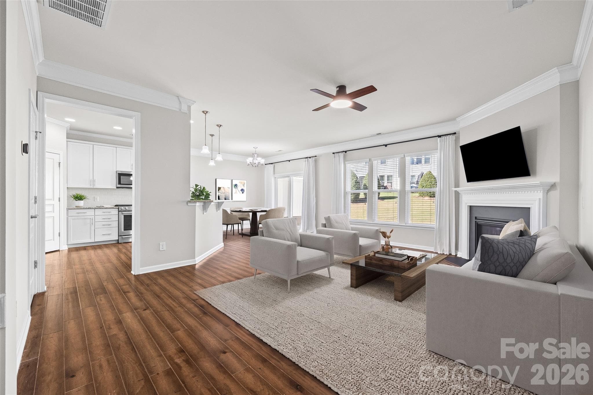 Virtually staged great room and dining area - 6607 Portland Rose Lane, Charlotte