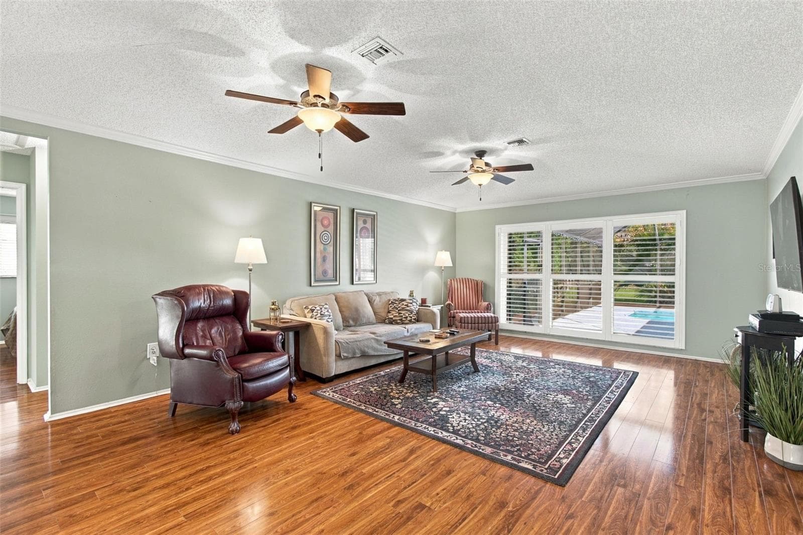 Living Room with Plantation Shutters - 5404 80TH AVENUE CIR E, PALMETTO