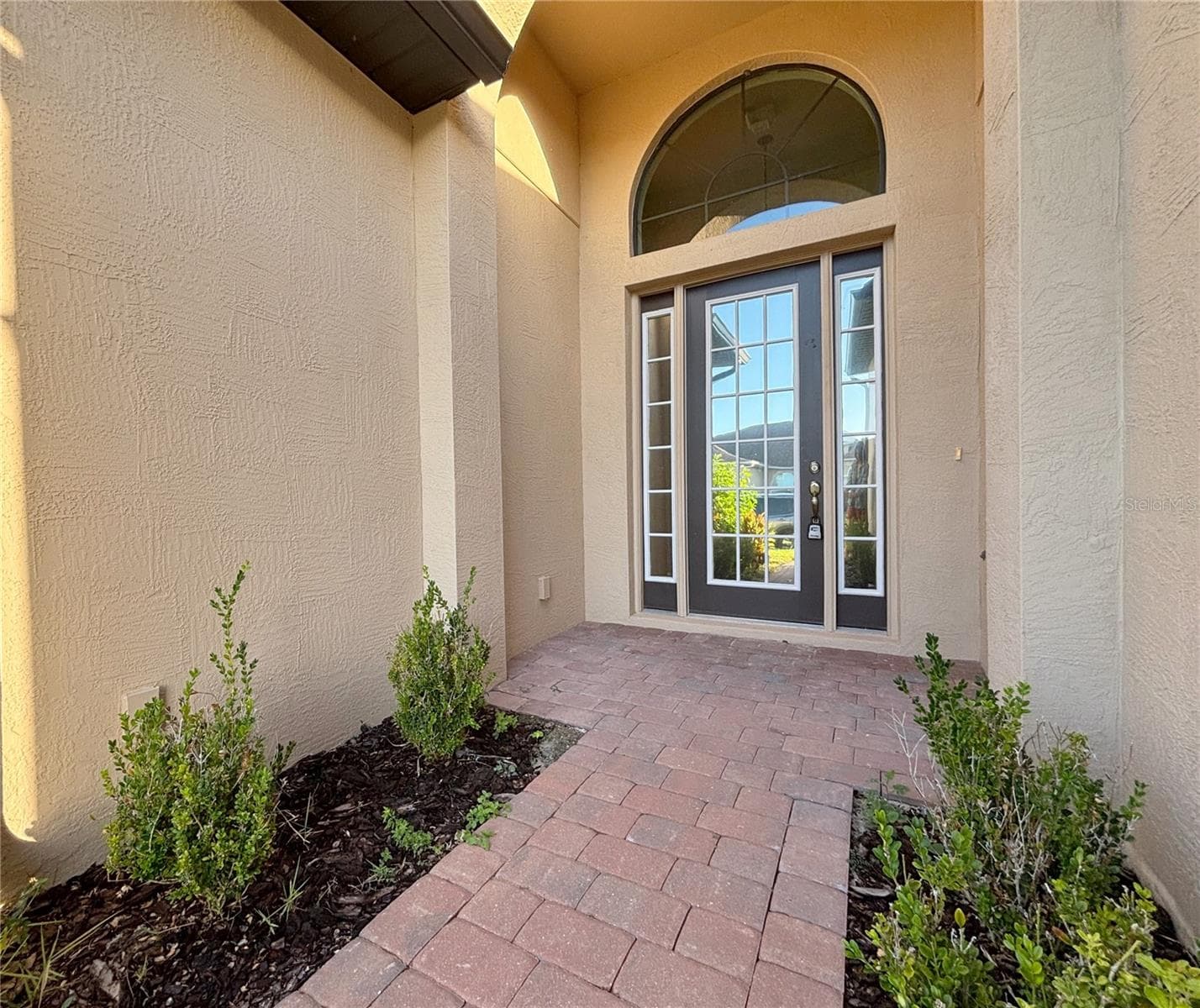 Front Entry with Glass Door. Privacy Tint on the Front Door - 6240 PINEHURST LOOP, WINTER HAVEN