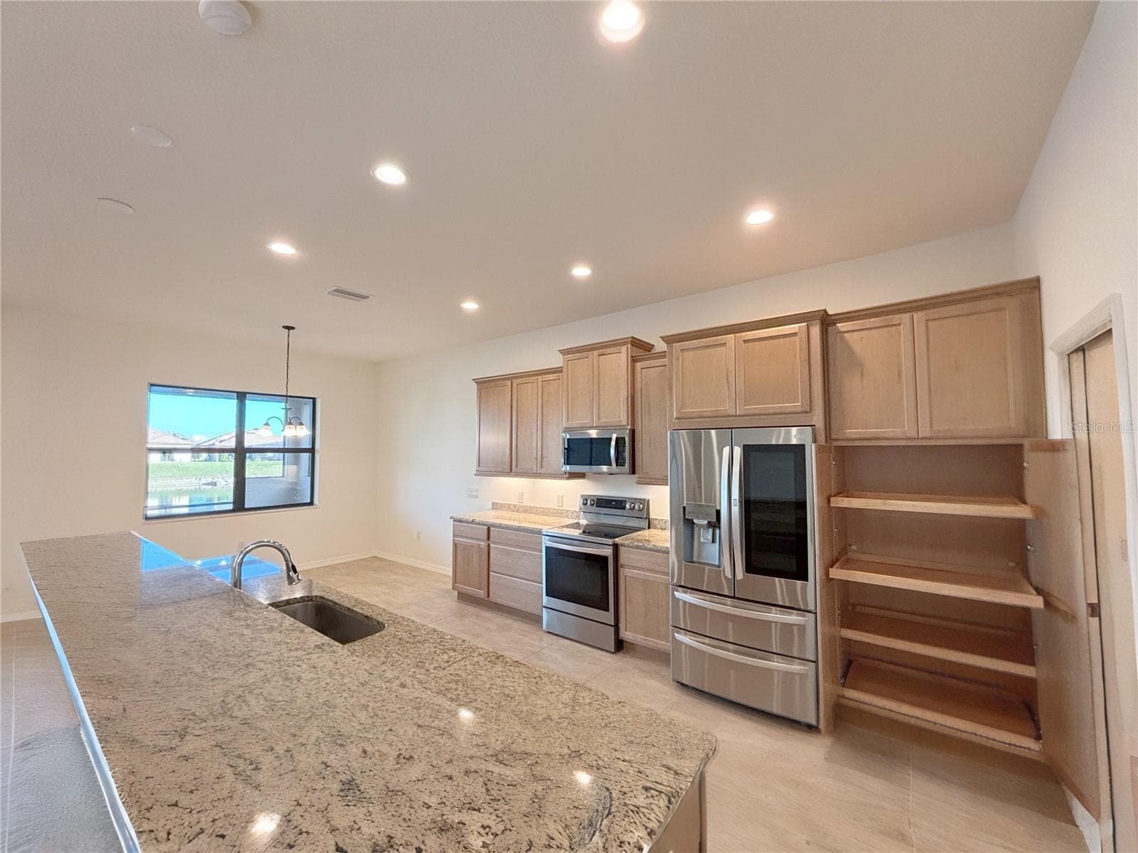 Pull Out Doors in the Pantry Cabinet. SS Appliances - 6240 PINEHURST LOOP, WINTER HAVEN