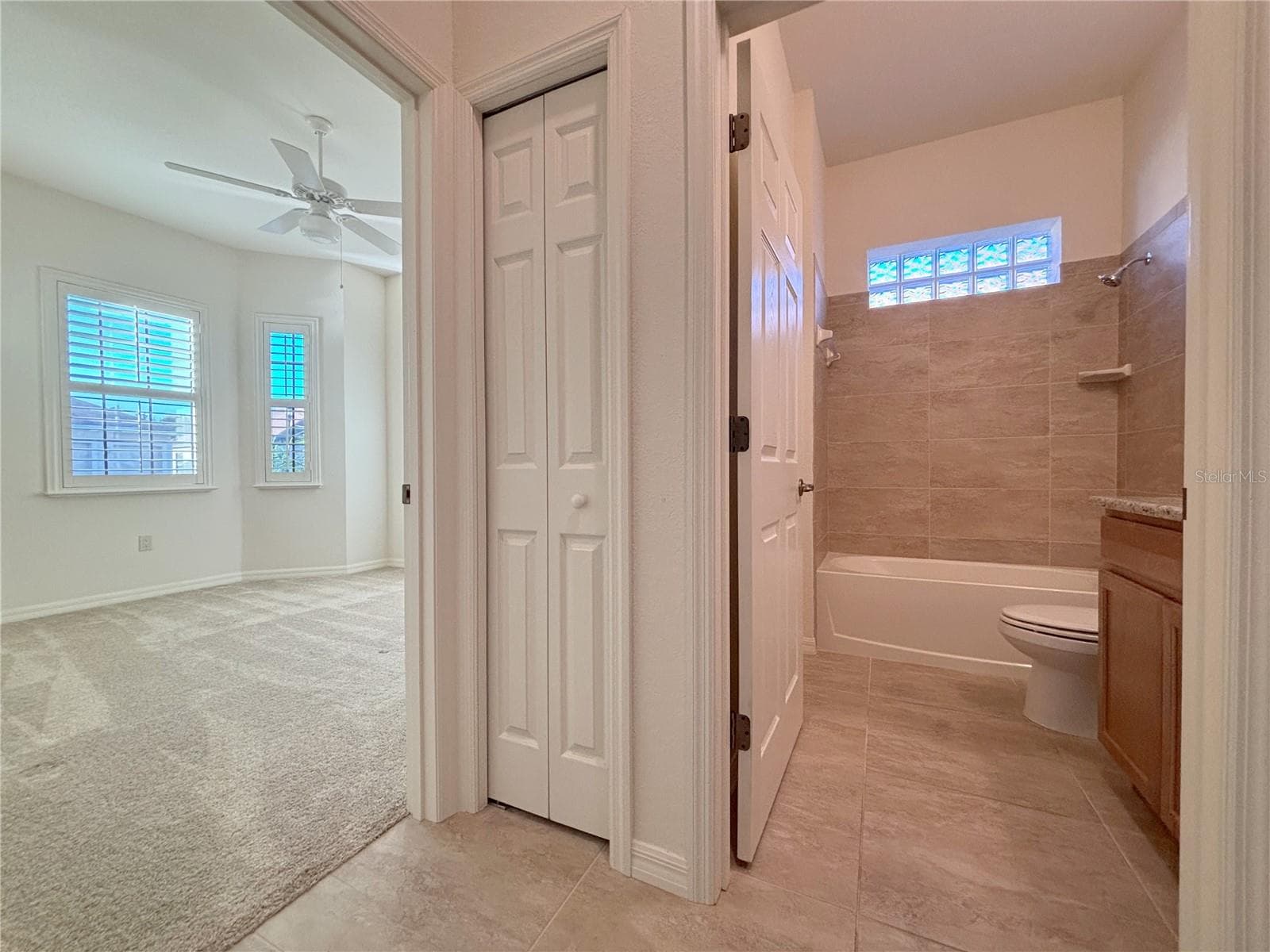 Linen Closet in Hallway with Guest Bath - 6240 PINEHURST LOOP, WINTER HAVEN