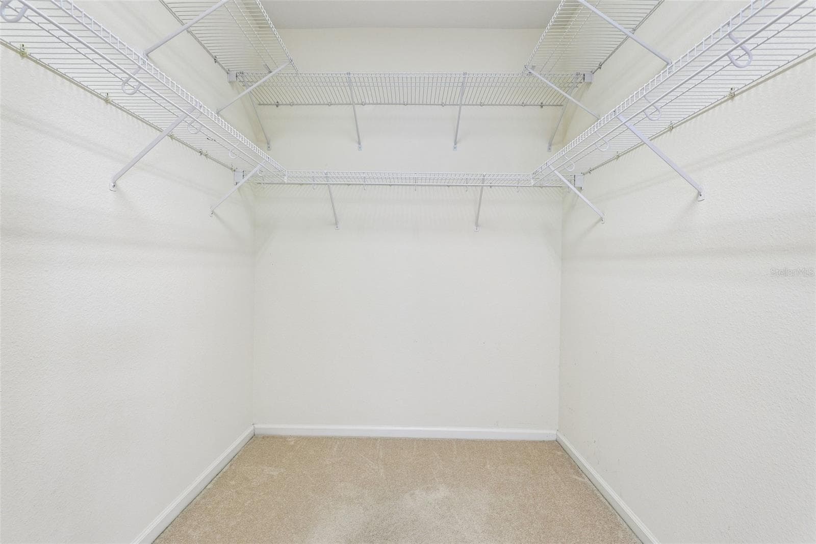 Primary suite walk-in closet. - 8525 WATERWILLOW PL, ORLANDO