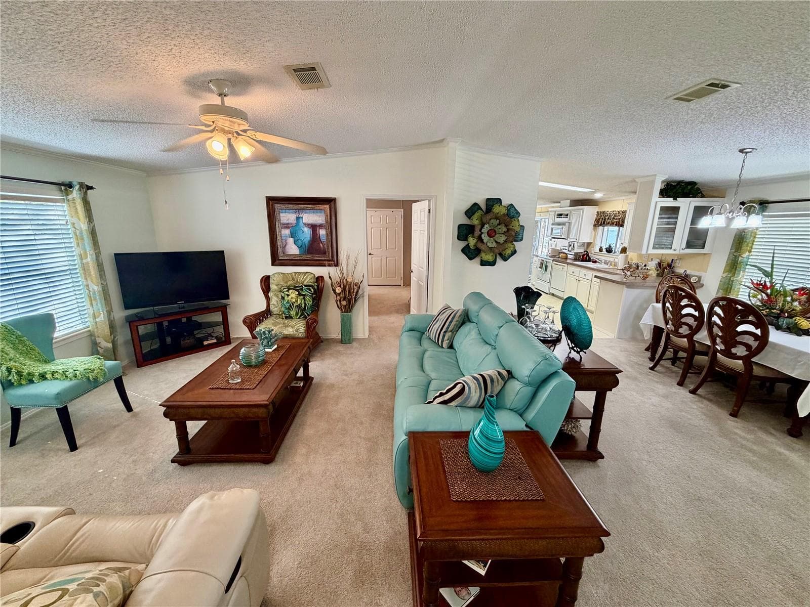 The door straight ahead on the left leads to the primary bedroom suite - 34012 AZALEA DR N, PINELLAS PARK