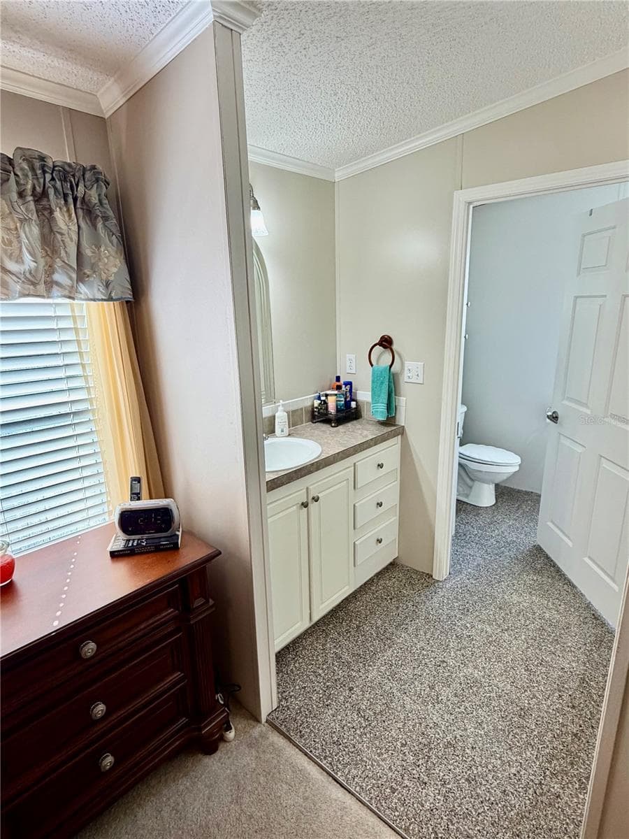 Primary Bathroom suite, features double sinks and walk in shower - 34012 AZALEA DR N, PINELLAS PARK
