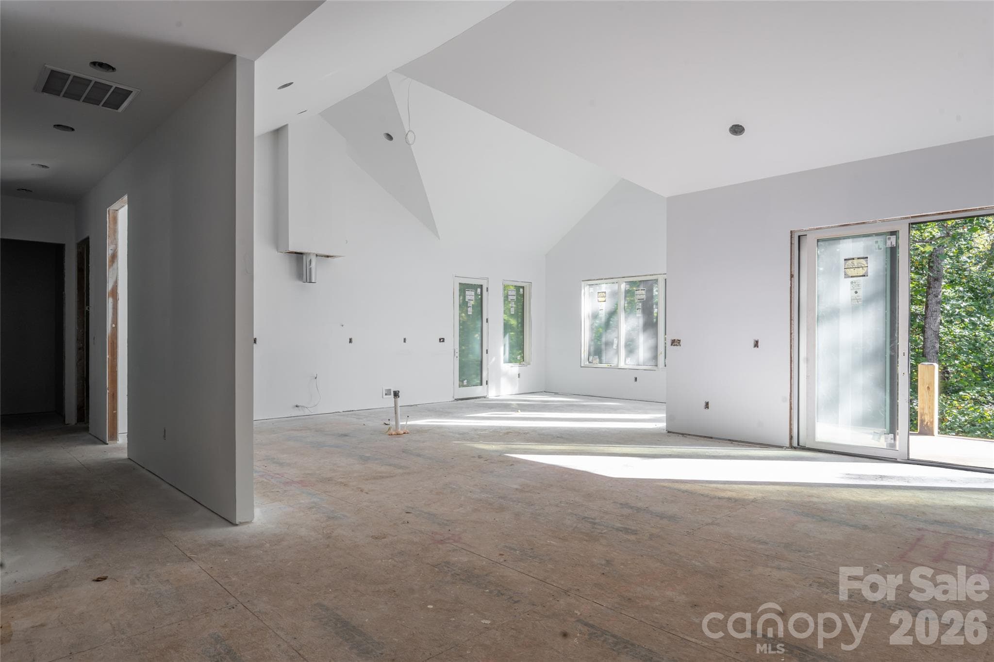 Expansive, open floorplan. Foyer looking into living, kitchen, and dining room. - 200 Bent Pine Trace, Hendersonville