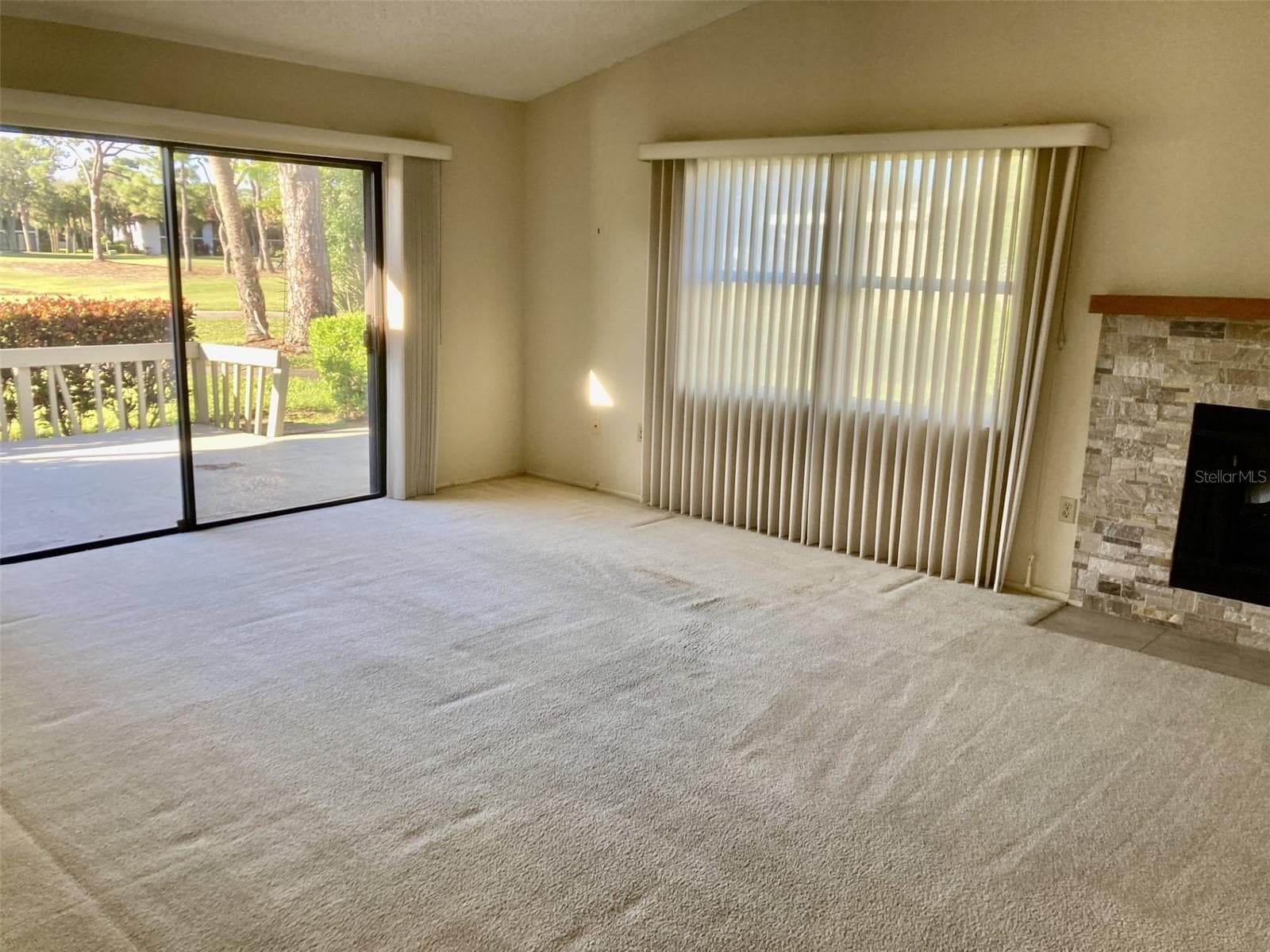 Living room with cathedral ceilings. - 3407 AVENIDA MADERA #A, BRADENTON