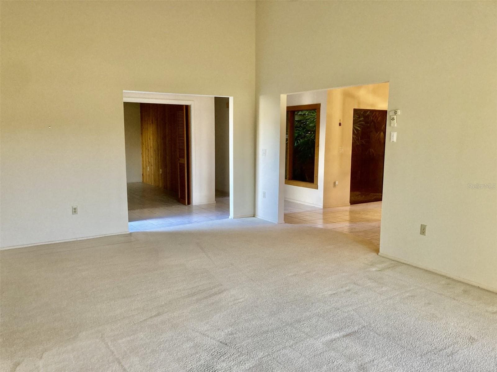 Living room to dining room. - 3407 AVENIDA MADERA #A, BRADENTON