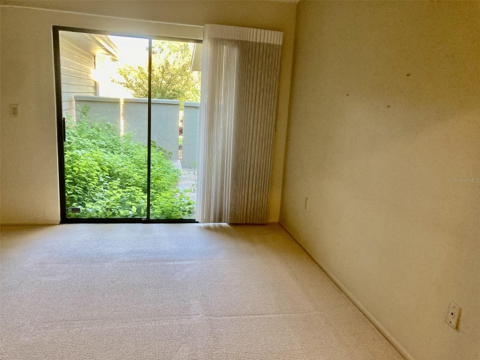 Master bedroom - sliding doors to walled in patio. - 3407 AVENIDA MADERA #A, BRADENTON