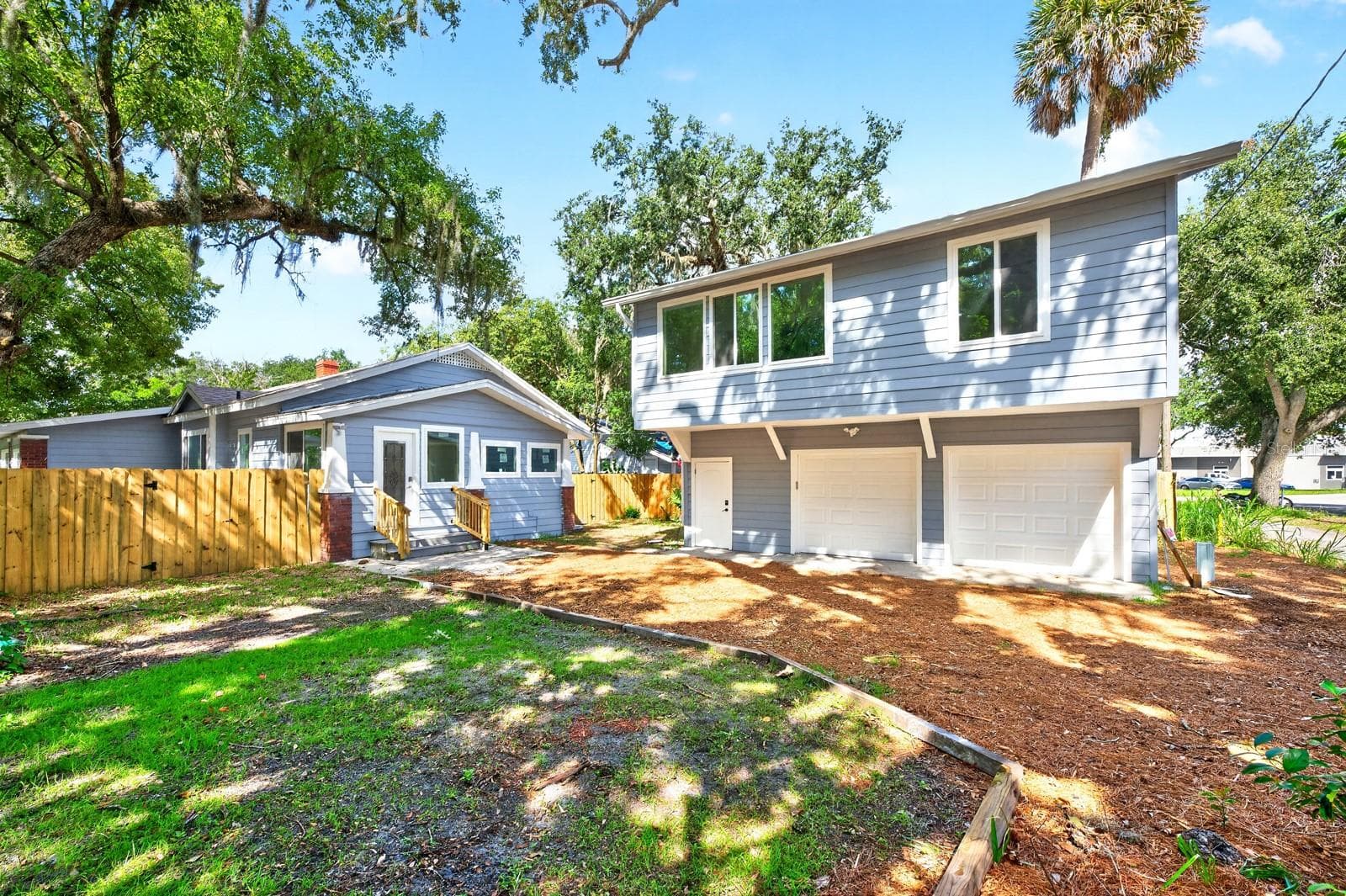 Completely remodeled and offering a total of 5 Bedrooms and 3 Baths between the main home and a separate guest residence, this distinctive property offers INCREDIBLE FLEXIBILITY for multigenerational living, hosting guests or exploring investment possibilities. - 211 S MAPLE AVE, SANFORD