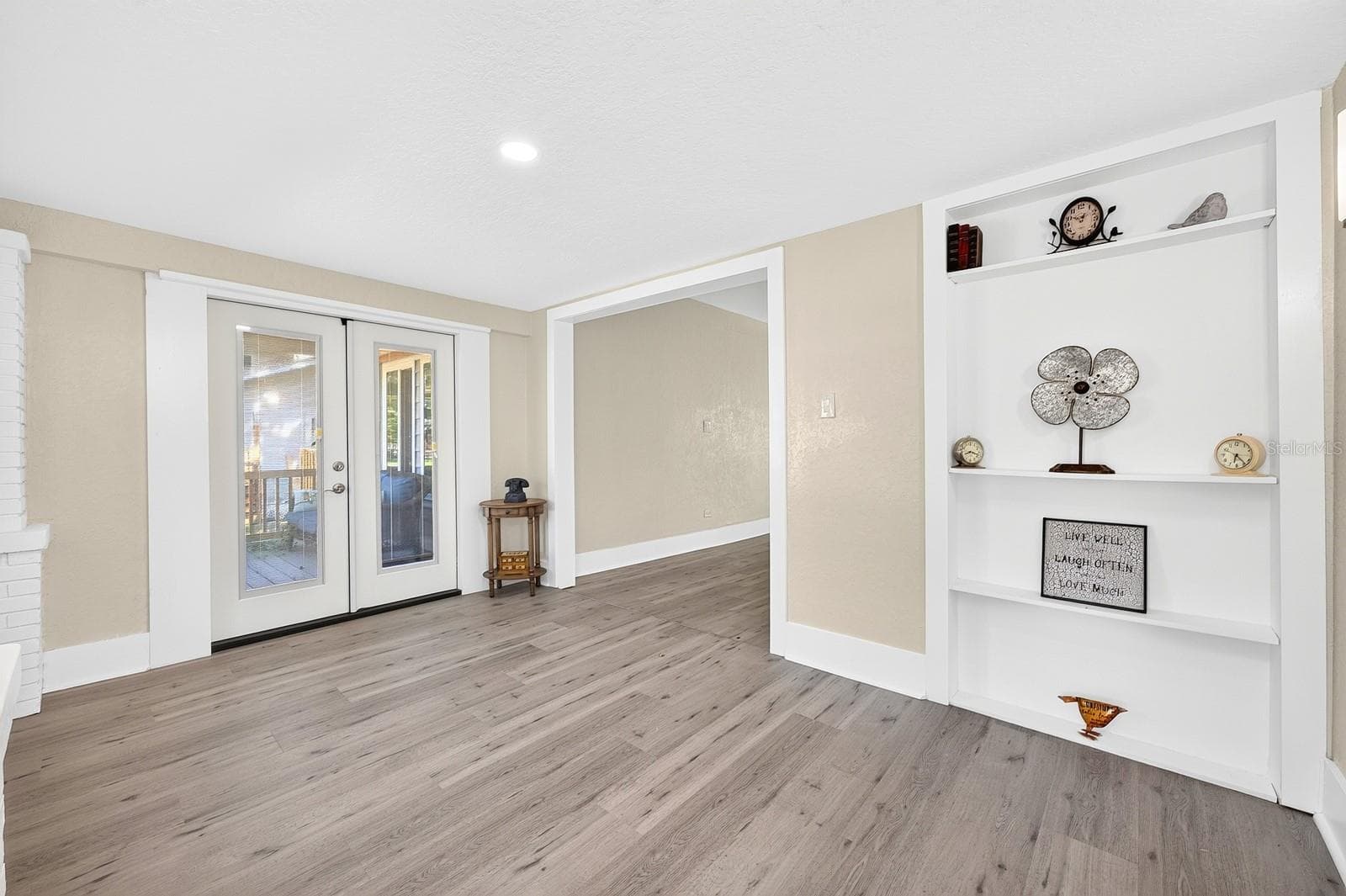 Step into the welcoming Foyer, where double doors open to a beautiful side porch. - 211 S MAPLE AVE, SANFORD