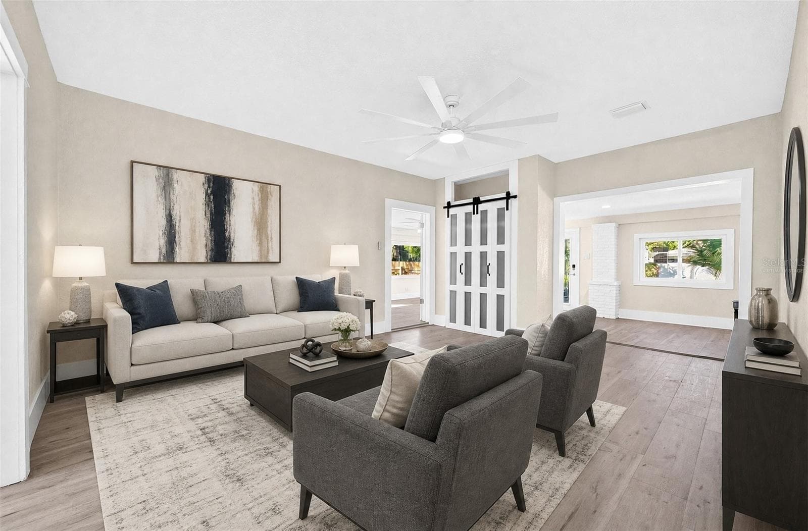 The spacious Living Room provides a comfortable gathering space. Virtually Staged - 211 S MAPLE AVE, SANFORD