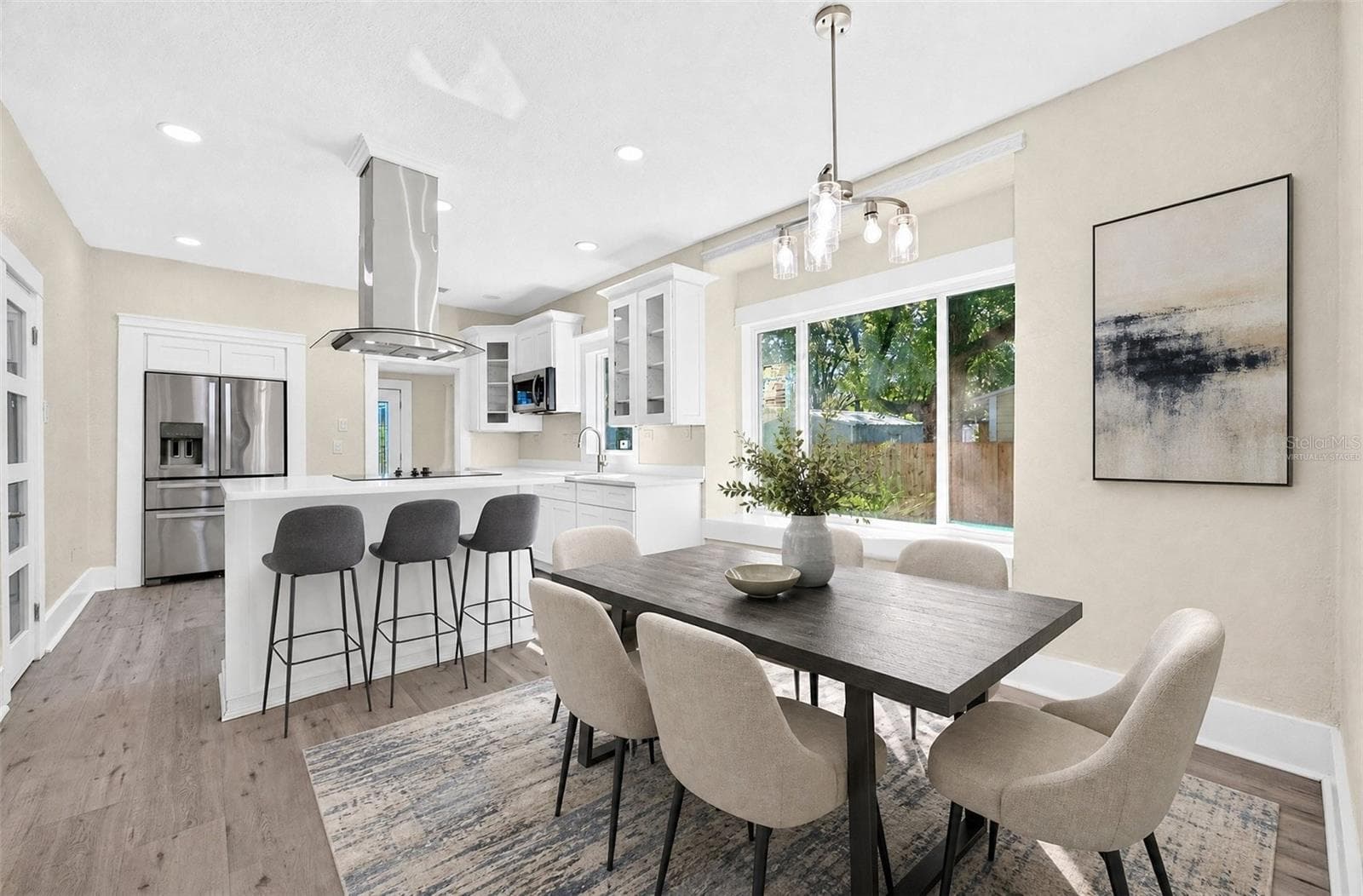 A large picture window in the Dining Room fills the space with NATURAL LIGHT. Virtually Staged - 211 S MAPLE AVE, SANFORD
