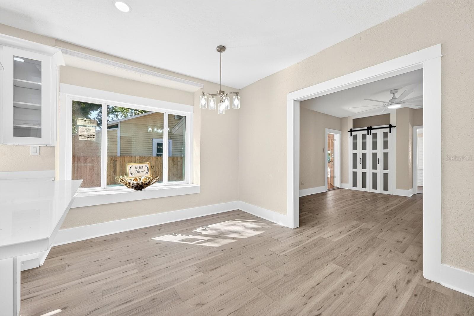 A large picture window in the Dining Room fills the space with NATURAL LIGHT. - 211 S MAPLE AVE, SANFORD