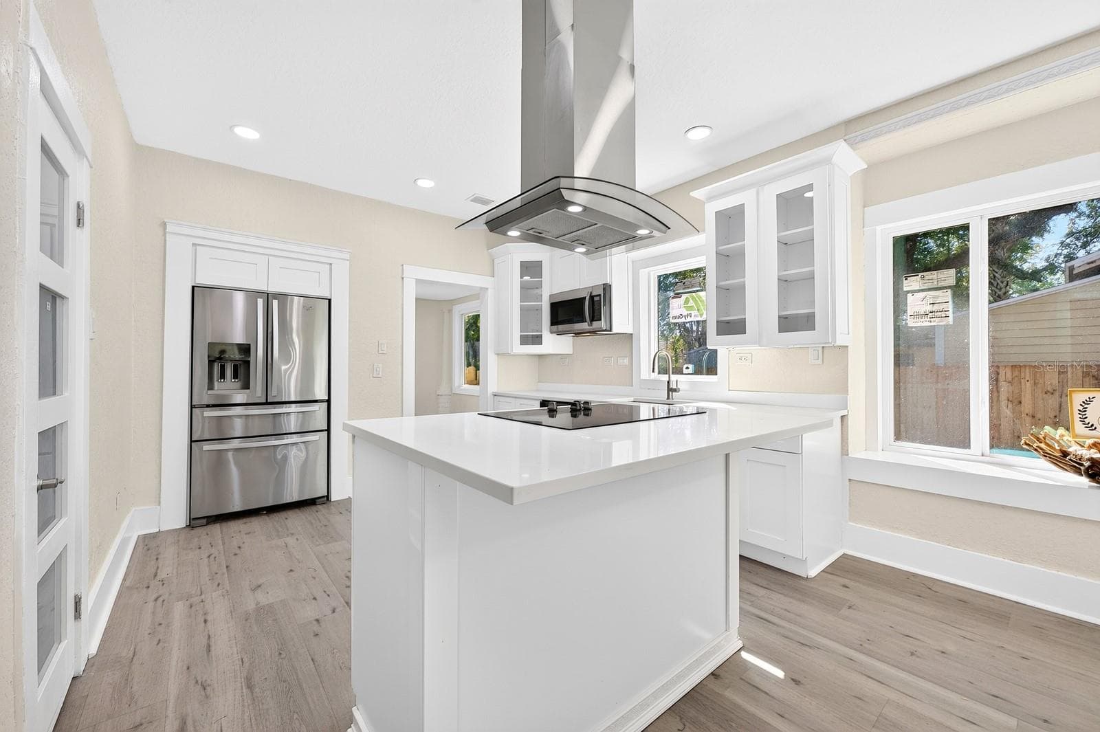 The center island also has room for counter-height stools. - 211 S MAPLE AVE, SANFORD