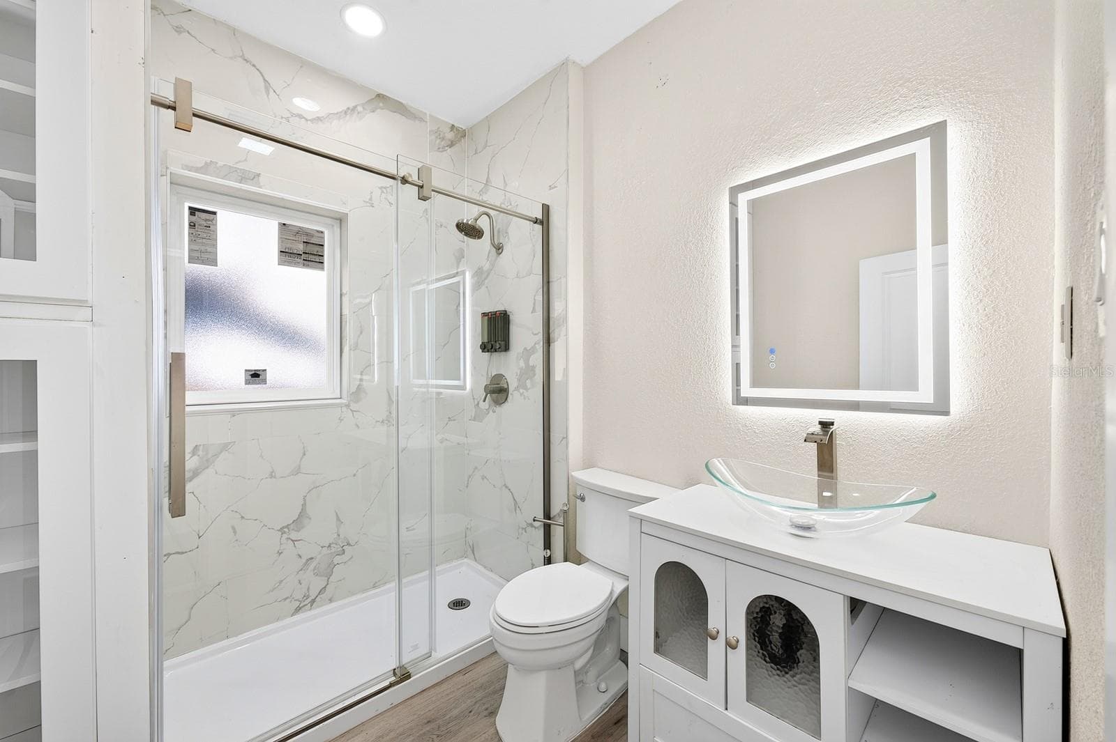 Both bathrooms feature elegant FLOOR-TO-CEILING TILE SHOWERS for a polished, contemporary finish. Bath 2 - 211 S MAPLE AVE, SANFORD