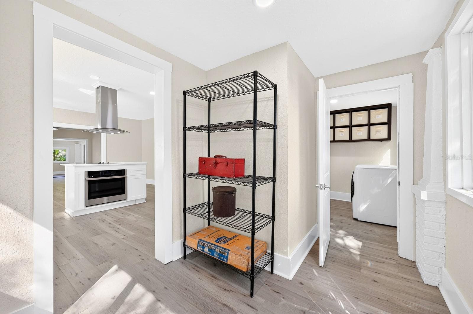 A nearby Mud Room provides convenient access to the FENCED YARD and the detached TWO-CAR GARAGE. - 211 S MAPLE AVE, SANFORD