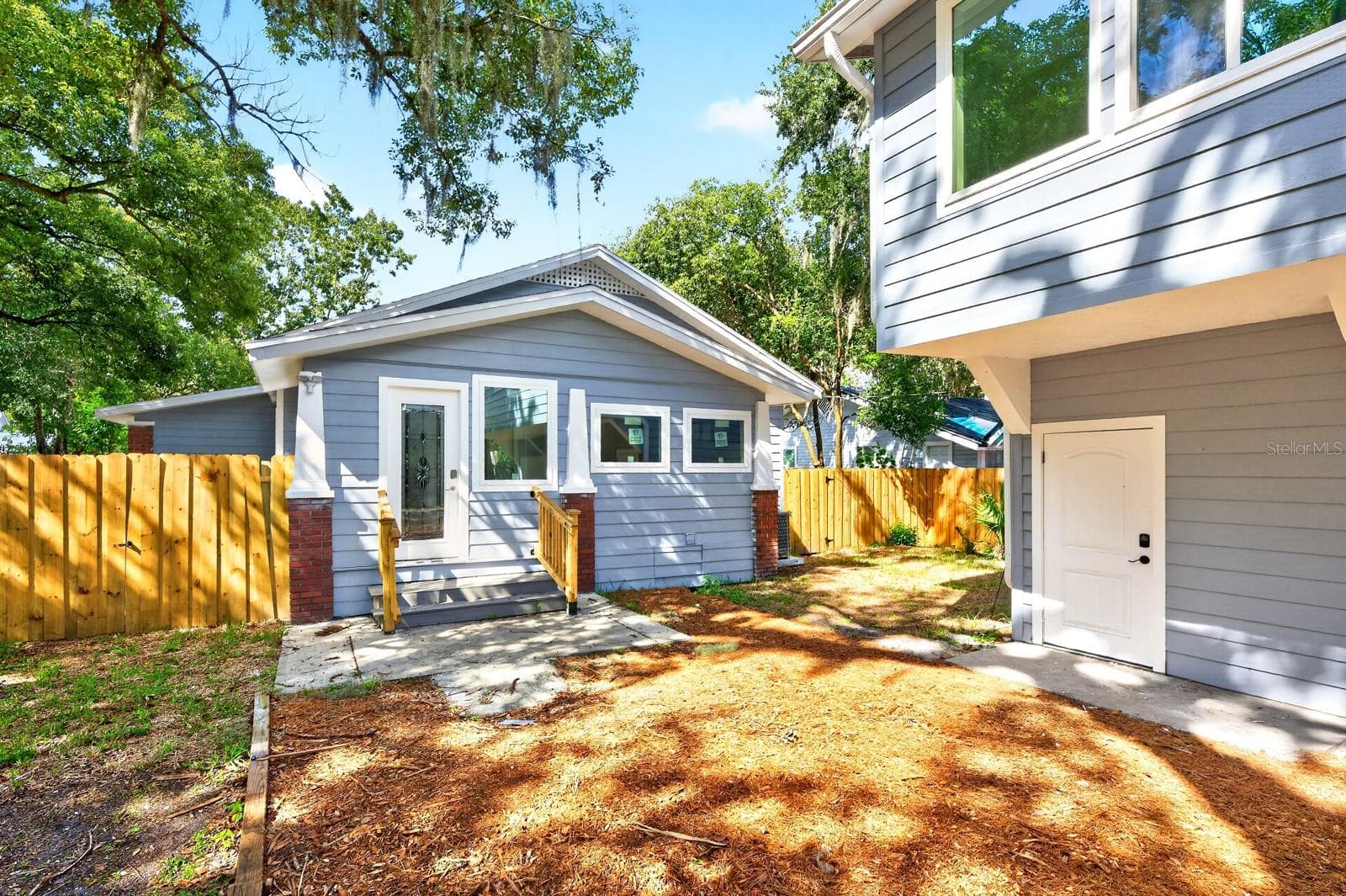A nearby Mud Room provides convenient access to the FENCED YARD and the detached TWO-CAR GARAGE. - 211 S MAPLE AVE, SANFORD