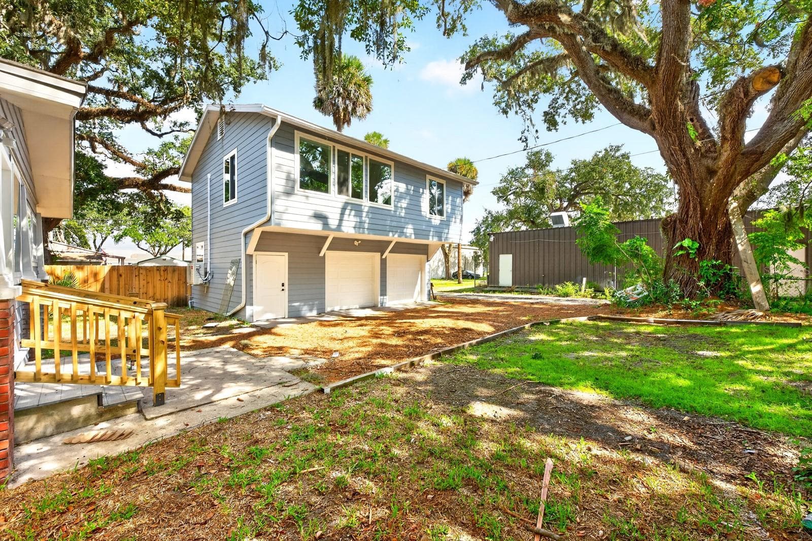 The 2-car garage and separate Guest Residence. - 211 S MAPLE AVE, SANFORD