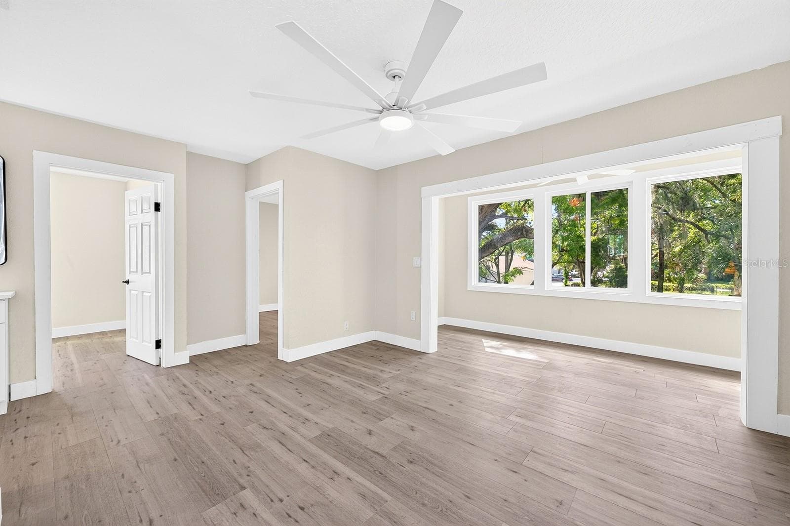 Whether used for extended family, multigenerational living, long-term guests or a POTENTIAL INCOME-PRODUCING INVESTMENT, the separate residence adds tremendous value and flexibility to the property. The Living Room - 211 S MAPLE AVE, SANFORD