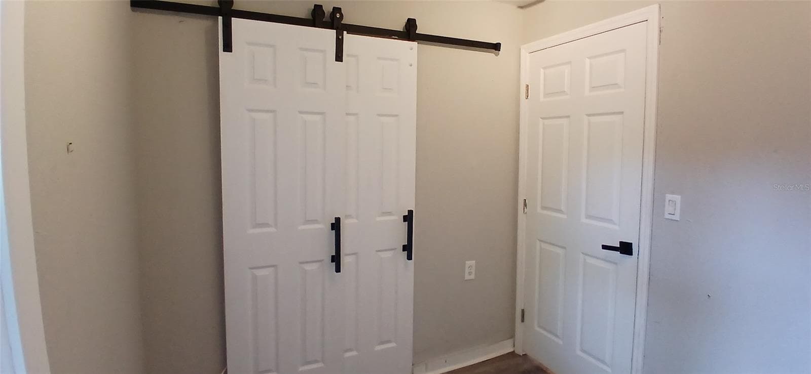 Bedroom 3 with Barn closet doors - 1549 S PROSPECT AVE, CLEARWATER