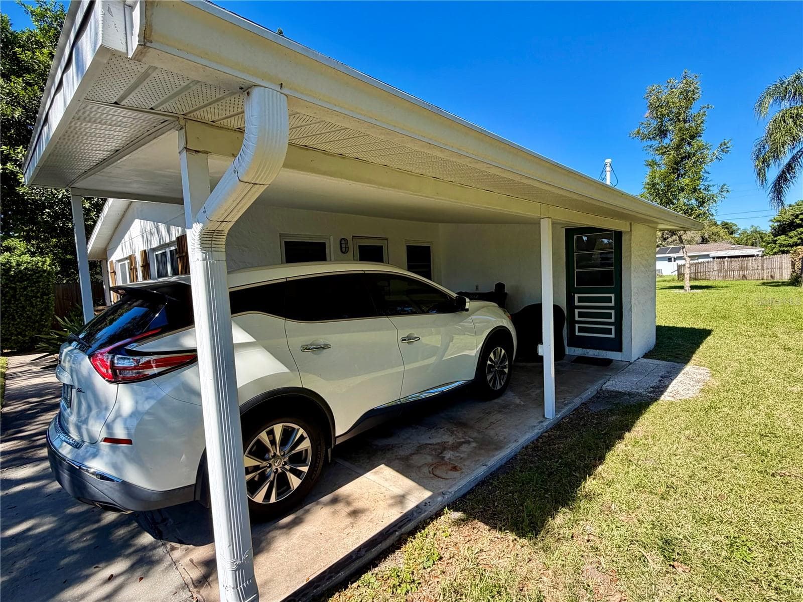 Dark door is the laundry room. Newer soffit and fascia - 6481 82ND AVE N, PINELLAS PARK