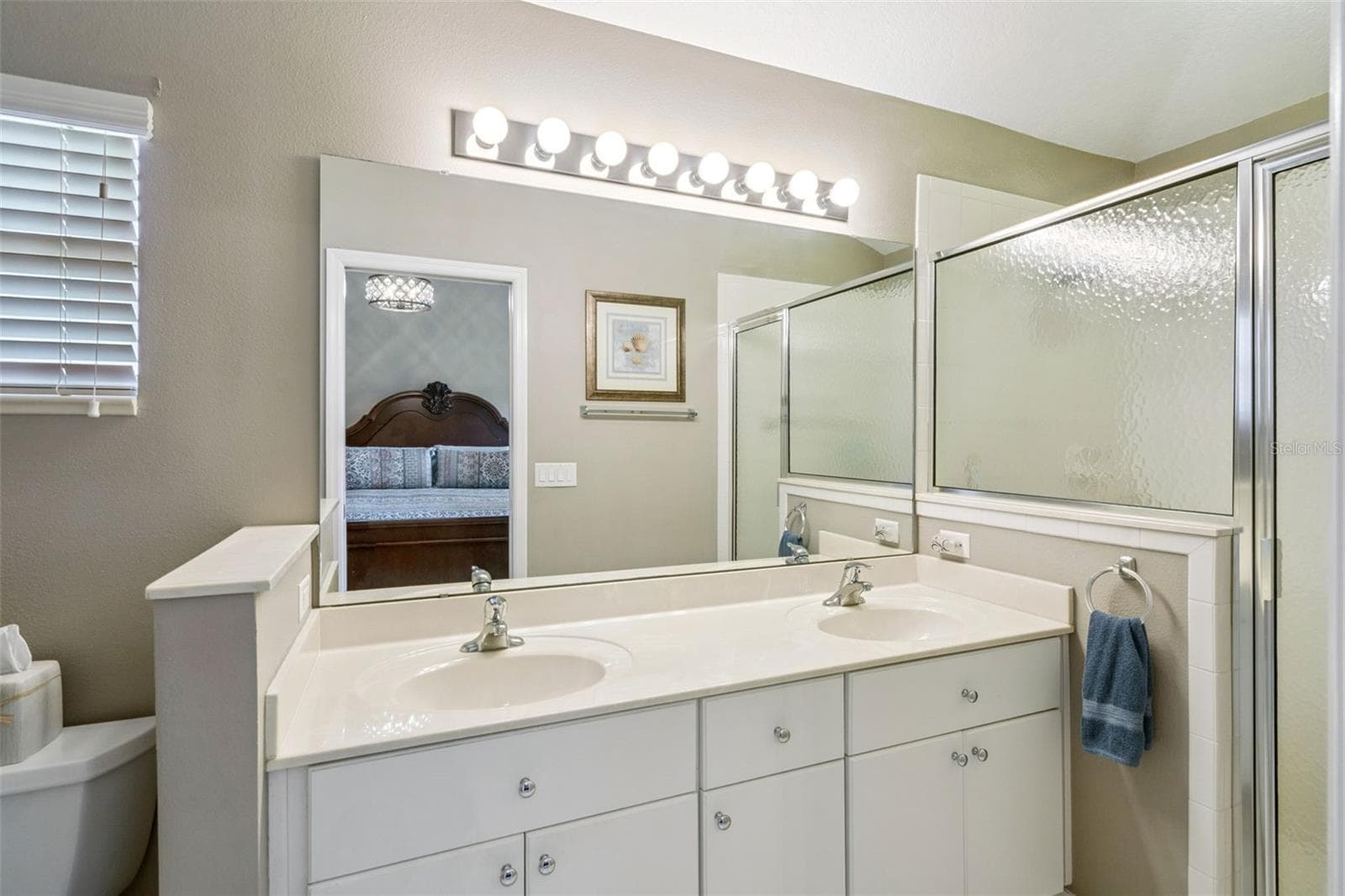 Primary bath with dual sinks and walk-in shower. - 4900 CANOE CT, TAVARES